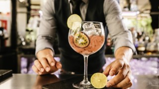 male-bartender-with-drink