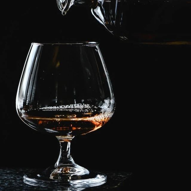 Photo by Eva Bronzini: https://www.pexels.com/photo/close-up-shot-of-an-alcoholic-drink-poured-into-a-snifter-glass-7254848/